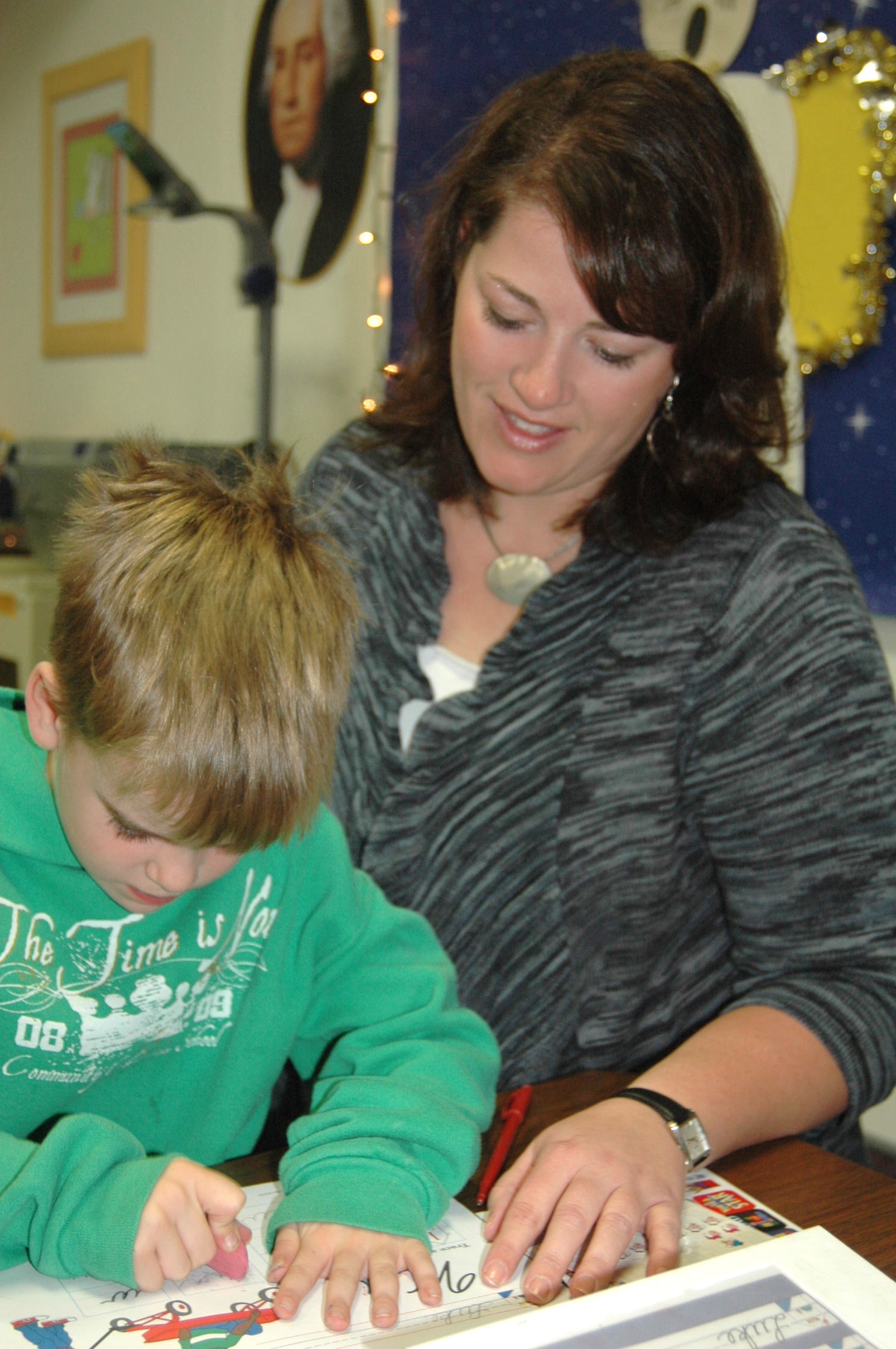 teacher helping student